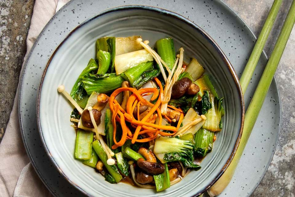 Wok dish with mushrooms and Asian vegetables